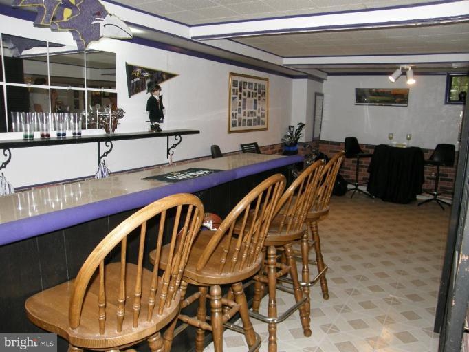 6221 Commons Road Rosedale, MD 21237 - Photo 24 of 27 a view of a dining room with furniture and window