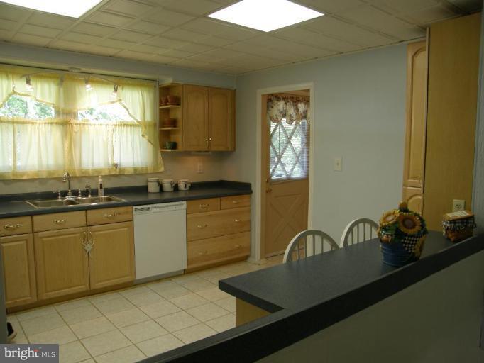 6221 Commons Road Rosedale, MD 21237 - Photo 6 of 27 a kitchen with a sink cabinets and window