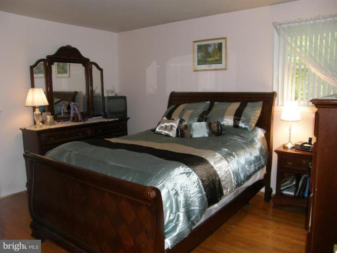6221 Commons Road Rosedale, MD 21237 - Photo 8 of 27 a bedroom with a bed and window