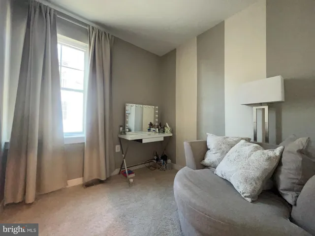 a hotel room with furniture and a window