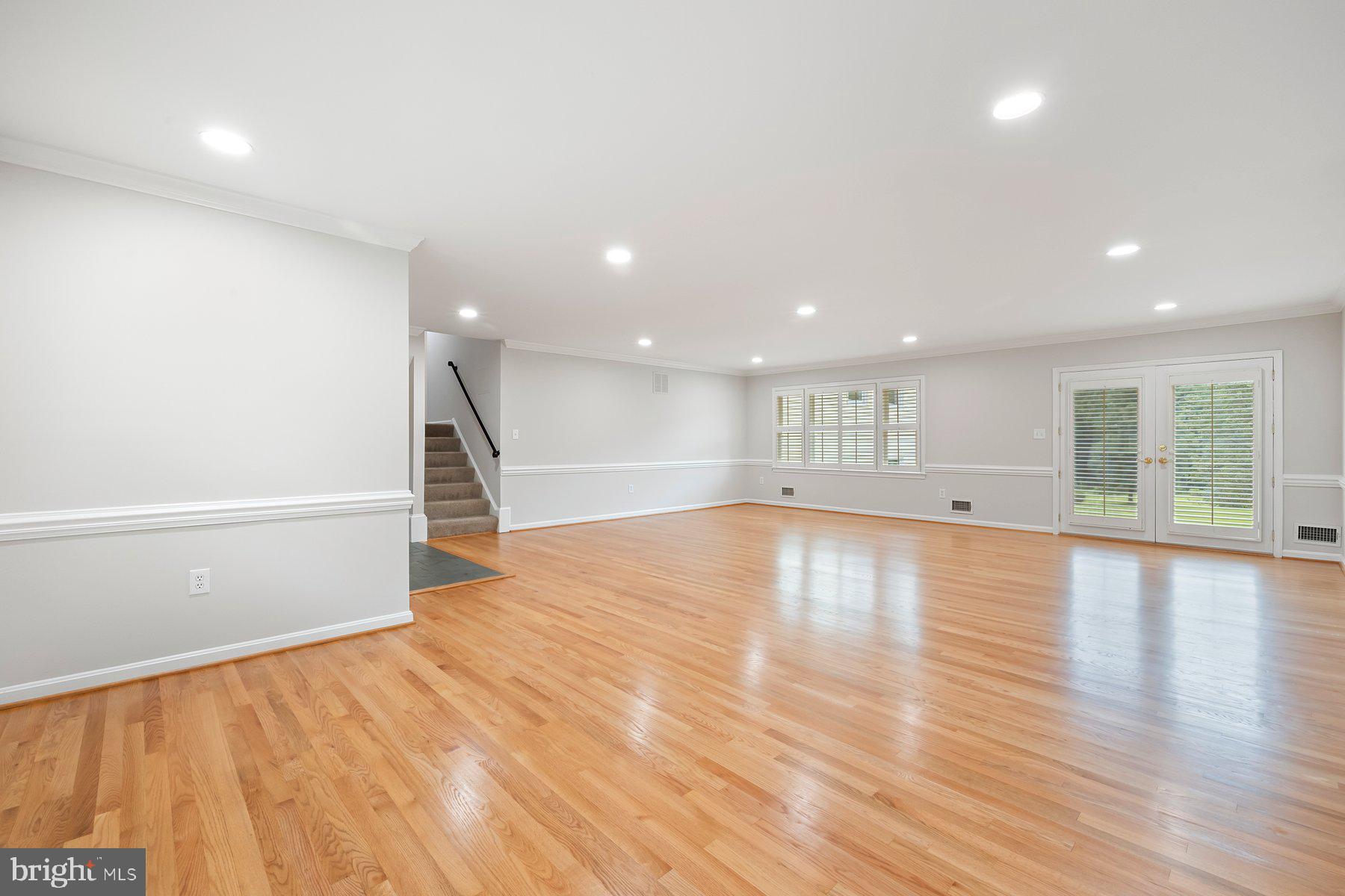 18604 Muncaster Road Rockville, MD 20855 - Photo 22 of 90 a view of empty room with wooden floor and window