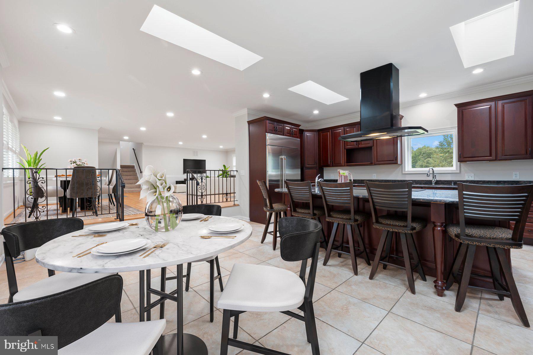18604 Muncaster Road Rockville, MD 20855 - Photo 26 of 90 a kitchen with kitchen island granite countertop lots of counter top space and stainless steel appliances