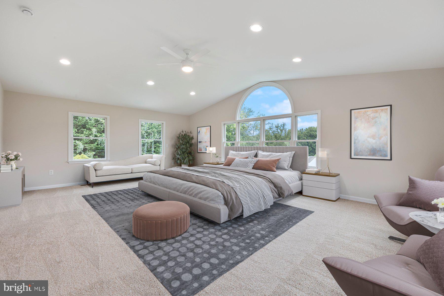 18604 Muncaster Road Rockville, MD 20855 - Photo 35 of 90 a spacious bedroom with a large bed and a window