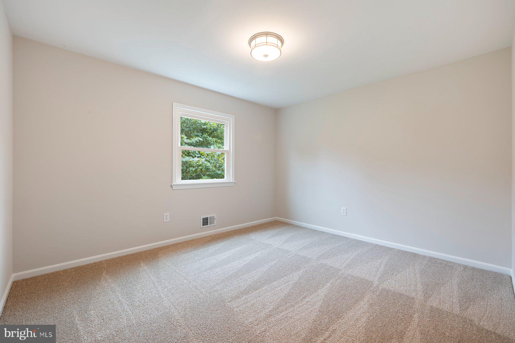 18604 Muncaster Road Rockville, MD 20855 - Photo 50 of 90 an empty room with windows
