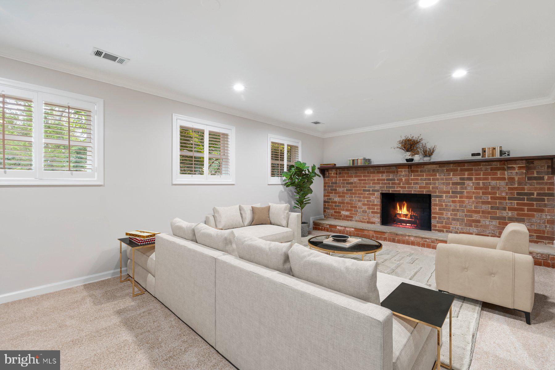 18604 Muncaster Road Rockville, MD 20855 - Photo 57 of 90 a living room with furniture and a fireplace