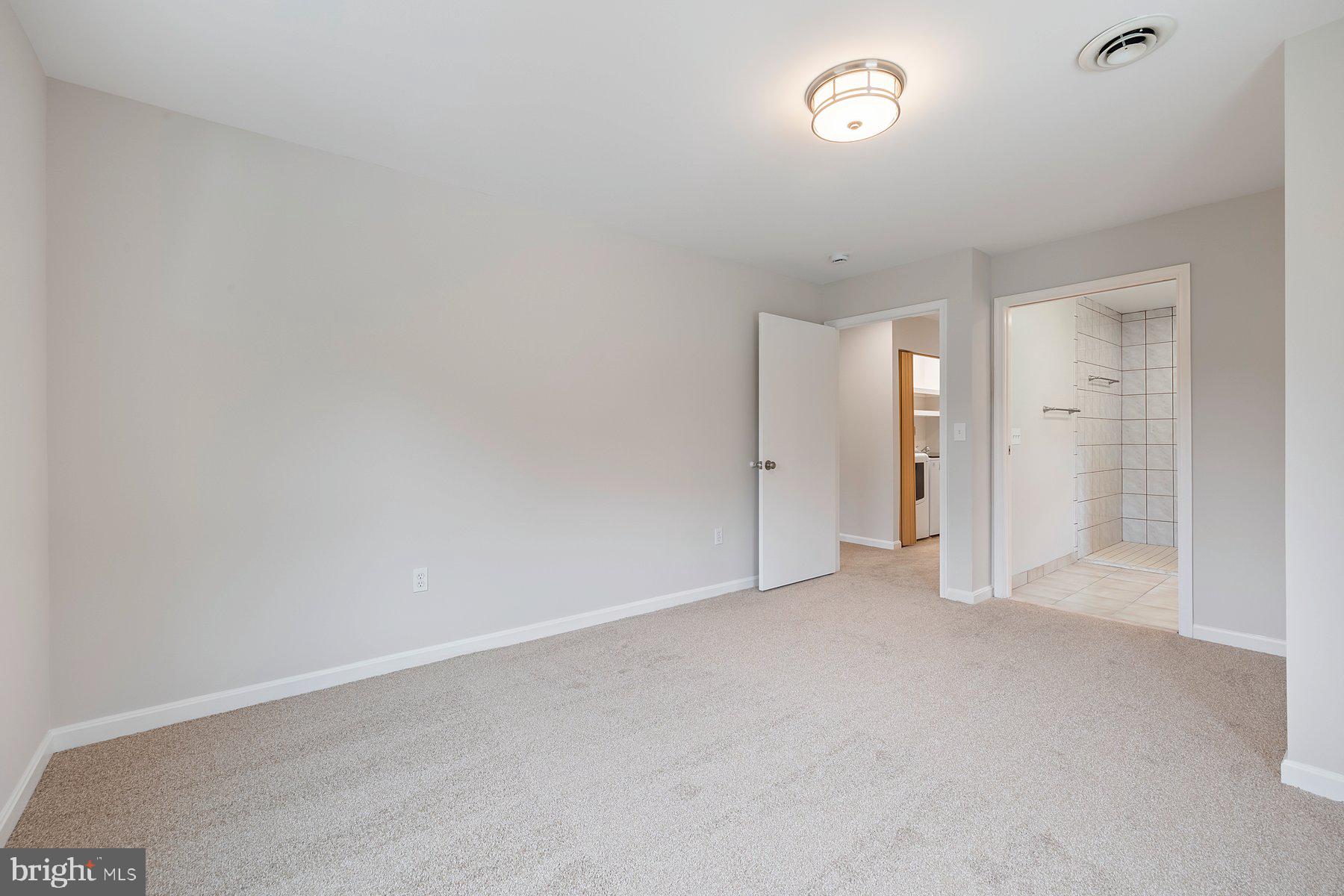 18604 Muncaster Road Rockville, MD 20855 - Photo 66 of 90 a view of an empty room and a window