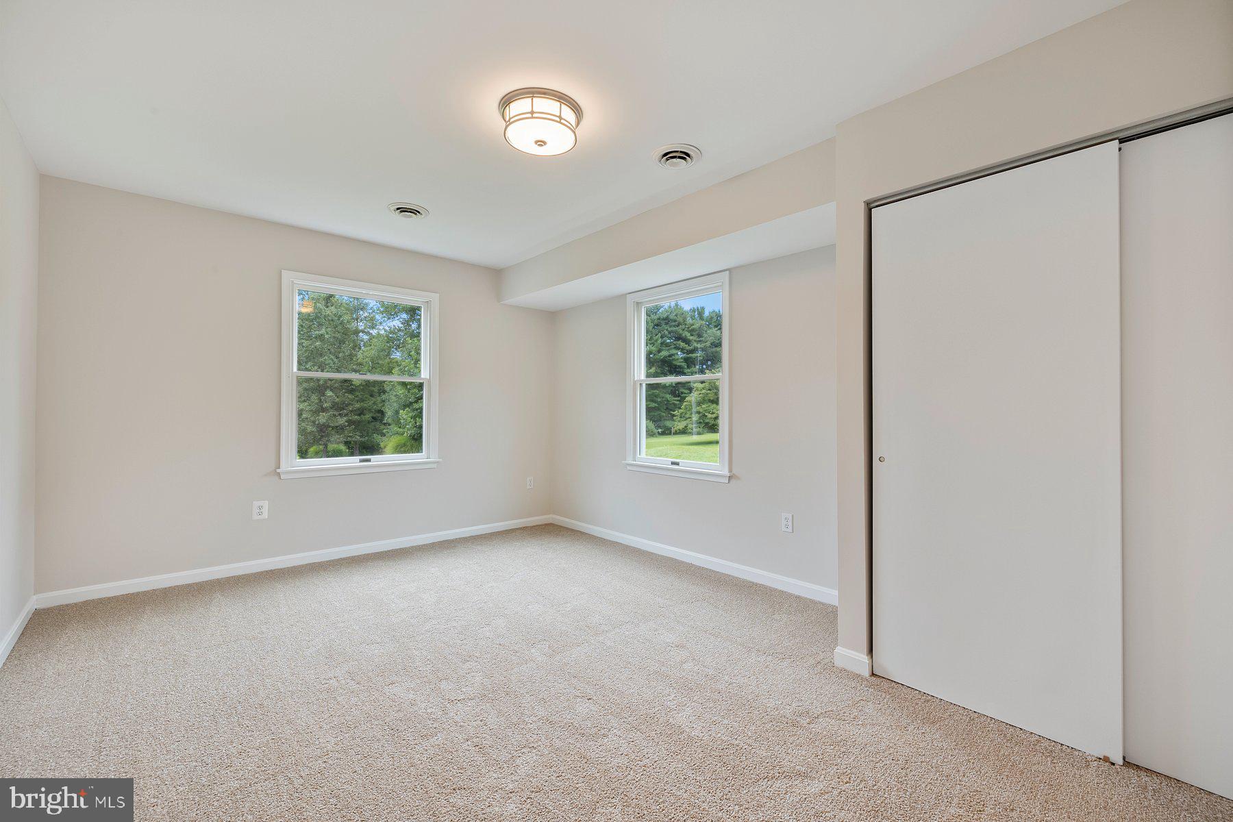 18604 Muncaster Road Rockville, MD 20855 - Photo 68 of 90 an empty room with windows and closet