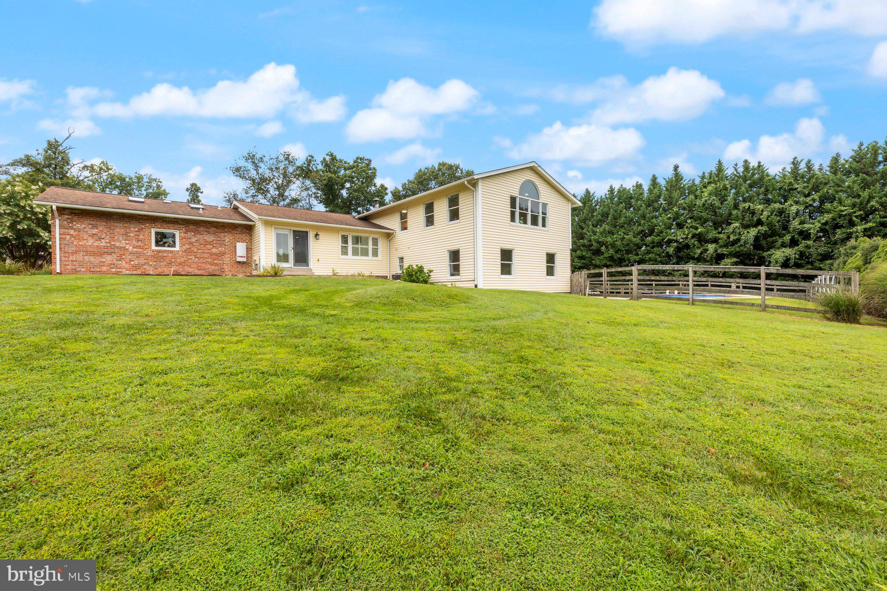 18604 Muncaster Road Rockville, MD 20855 - Photo 83 of 90 a view of a house with a yard