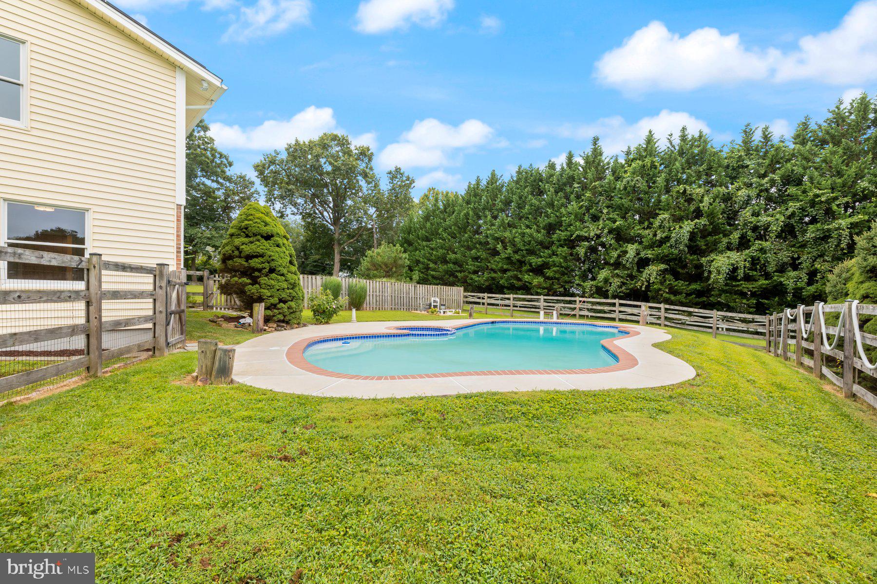 18604 Muncaster Road Rockville, MD 20855 - Photo 90 of 90 a view of a swimming pool with an outdoor space