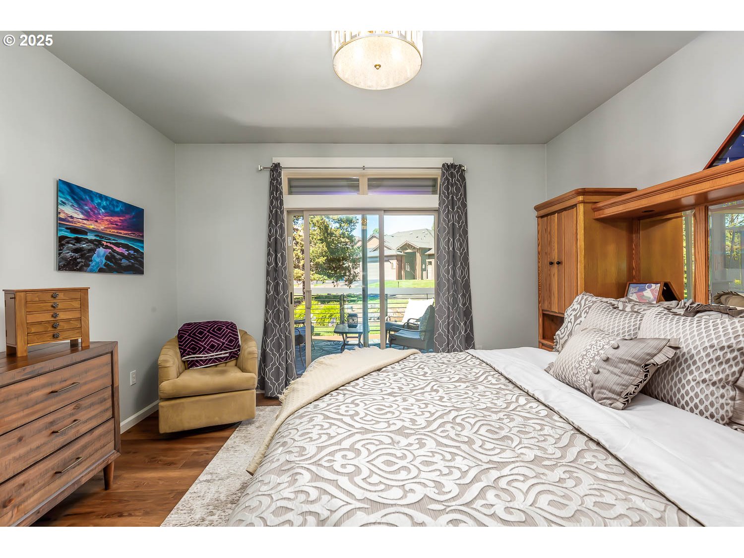 8413 Forest Ridge Loop Redmond, OR 97756 - Photo 16 of 40 a bedroom with a bed and a couch