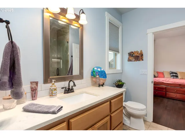 a view of a workspace with wooden floor and livingroom view