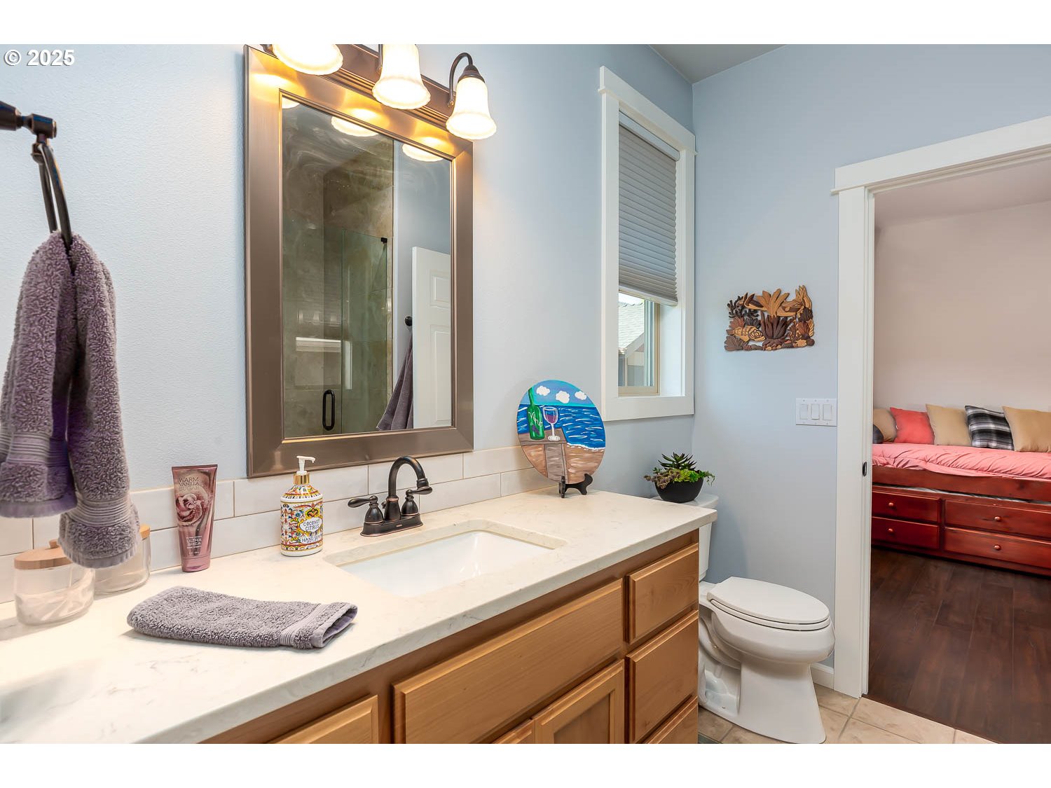 8413 Forest Ridge Loop Redmond, OR 97756 - Photo 23 of 40 a bathroom with a granite countertop sink toilet a large mirror and shower