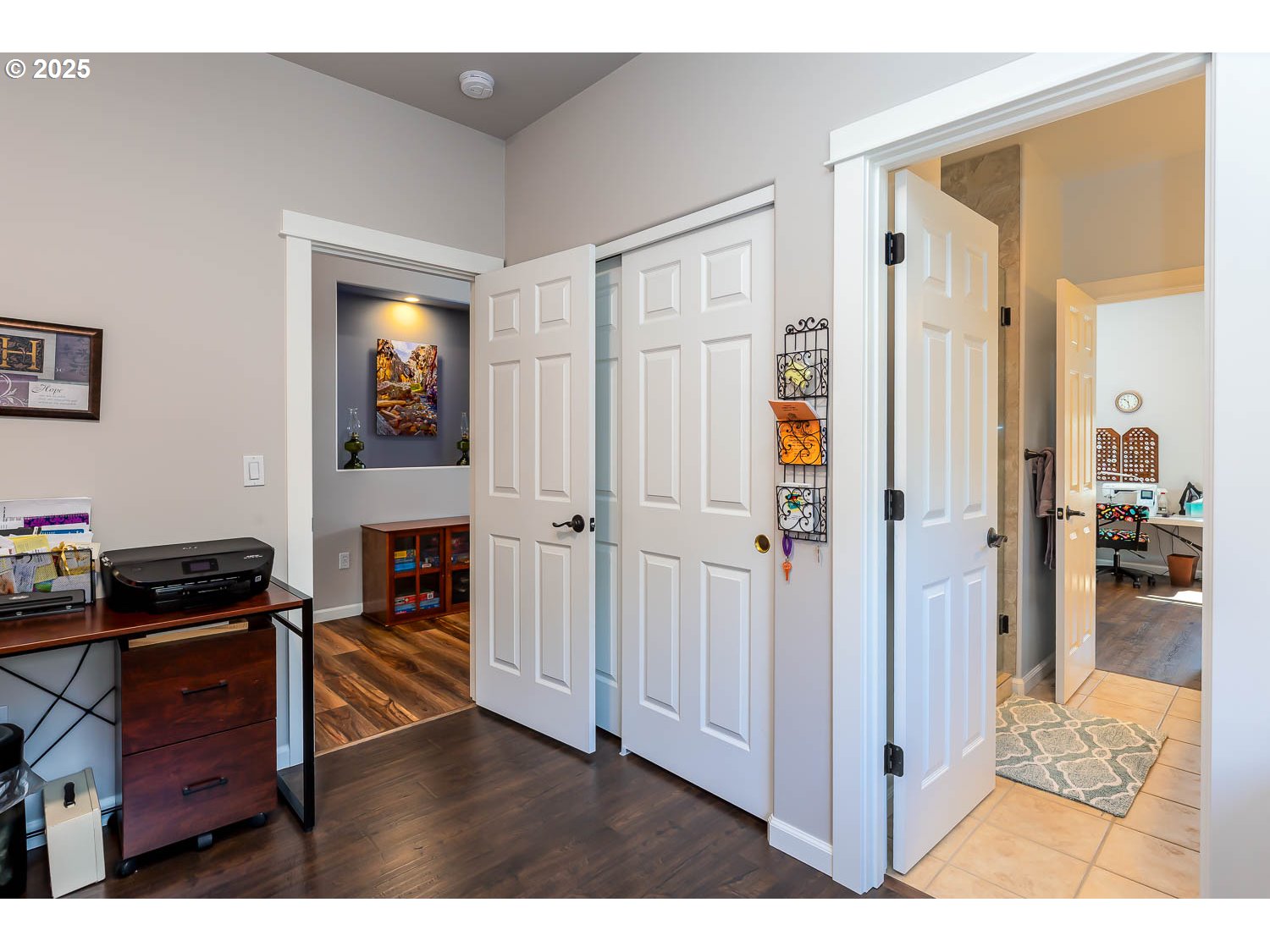 8413 Forest Ridge Loop Redmond, OR 97756 - Photo 24 of 40 a view of a workspace with wooden floor and livingroom view