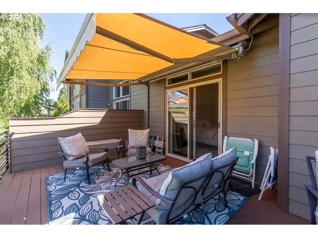 a outdoor space with patio the couches and a potted plant on the wall
