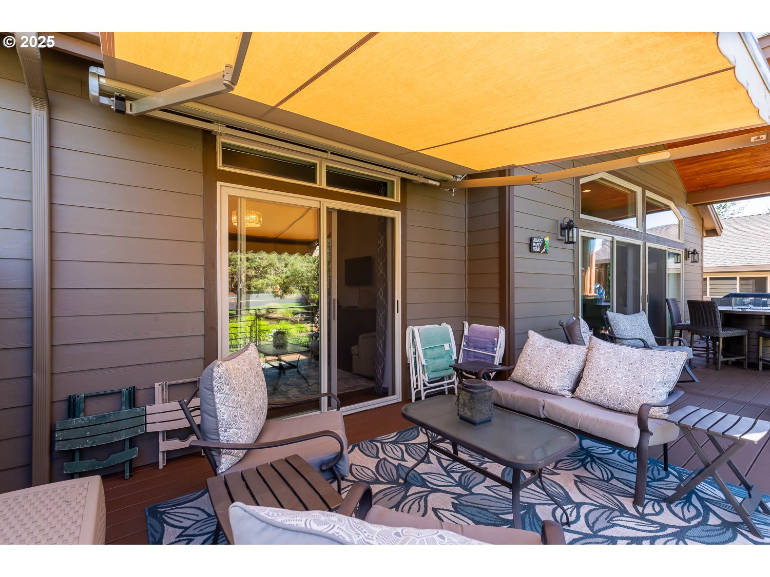 8413 Forest Ridge Loop Redmond, OR 97756 - Photo 36 of 40 a outdoor space with patio the couches and a potted plant on the wall