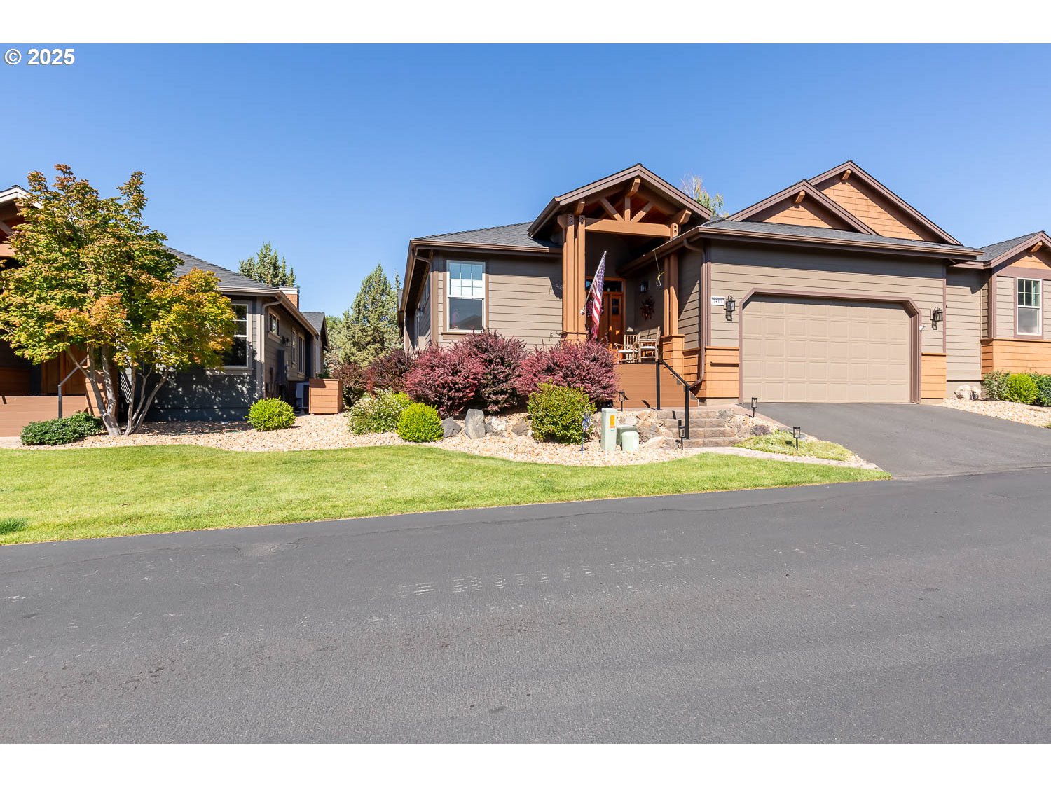 8413 Forest Ridge Loop Redmond, OR 97756 - Photo 39 of 40 a front view of a house with a yard and garage