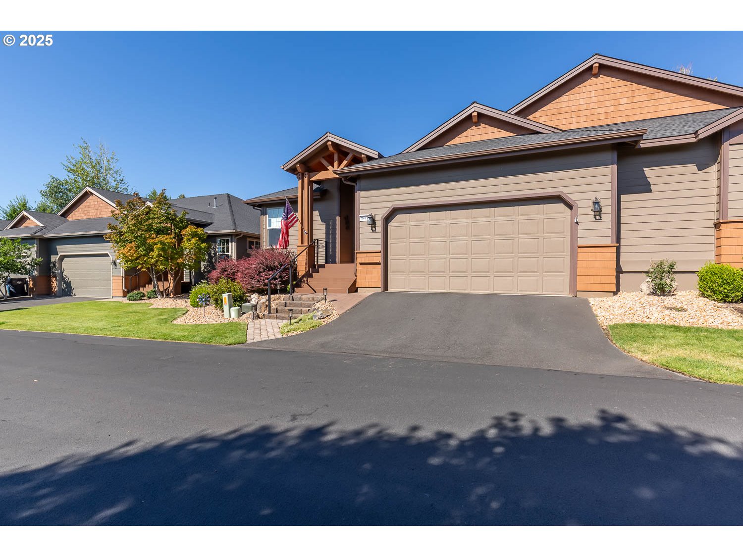 8413 Forest Ridge Loop Redmond, OR 97756 - Photo 40 of 40 a front view of a house with a yard and garage
