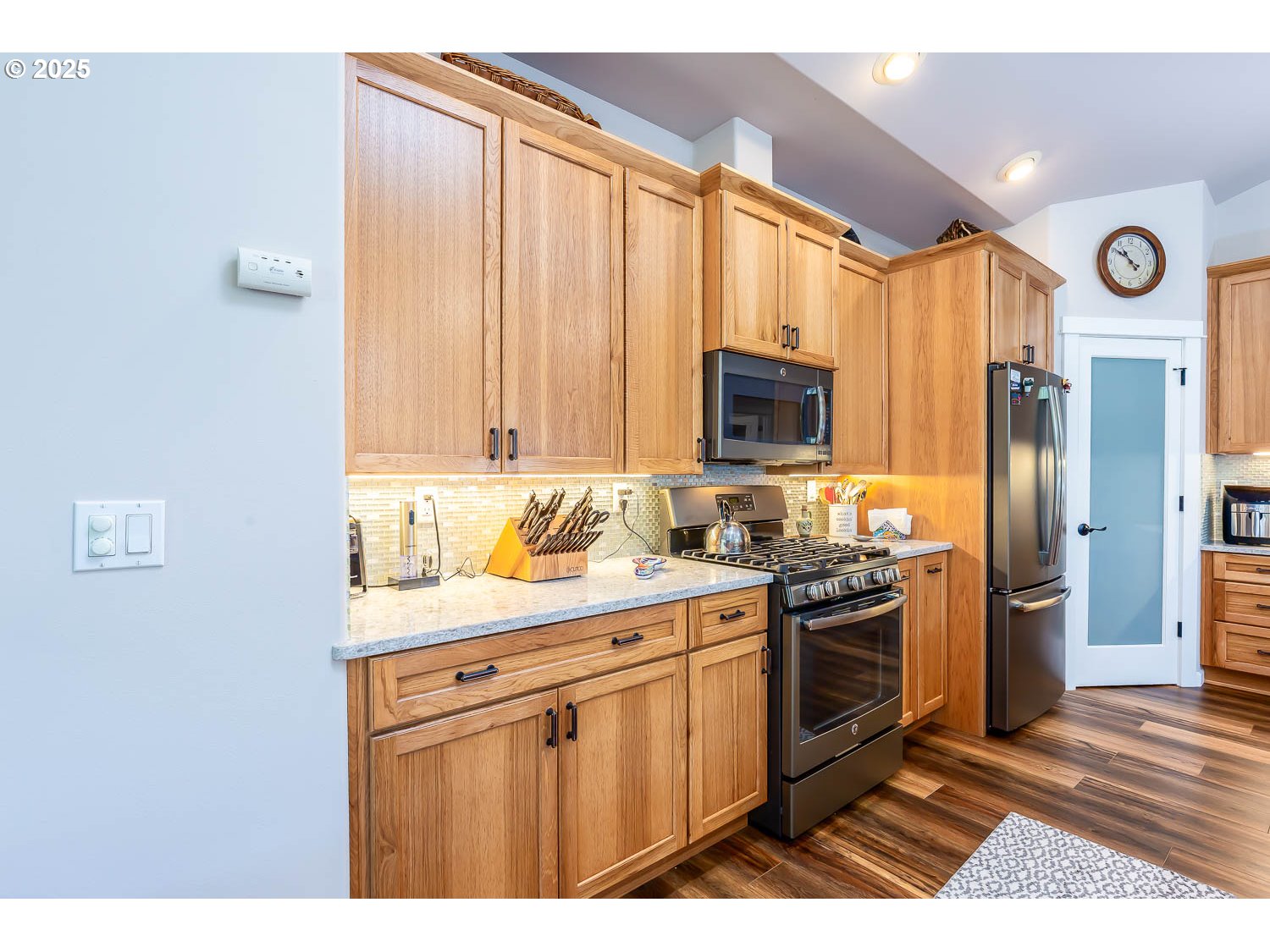 8413 Forest Ridge Loop Redmond, OR 97756 - Photo 9 of 40 a kitchen with stainless steel appliances granite countertop a stove a sink dishwasher and a refrigerator