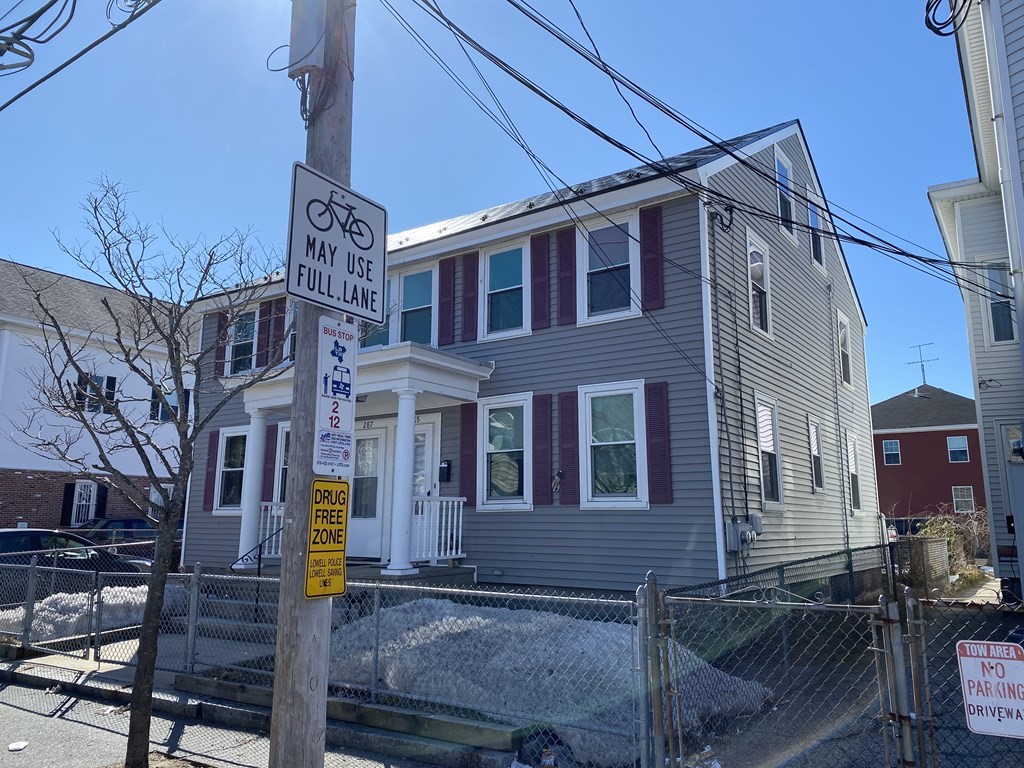 285 High Street Lowell, MA 01852 - Photo 2 of 8 a front view of a building with sitting area