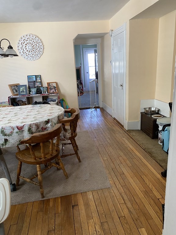 285 High Street Lowell, MA 01852 - Photo 7 of 8 a workspace with furniture and wooden floor