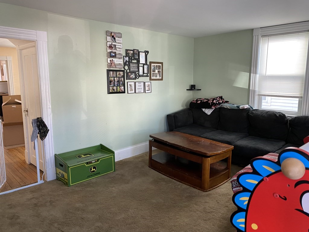 285 High Street Lowell, MA 01852 - Photo 8 of 8 a room with furniture and window