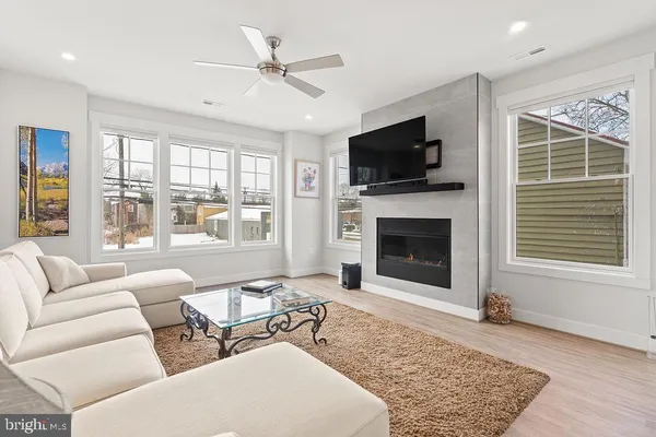 a view of a bedroom with wooden floor