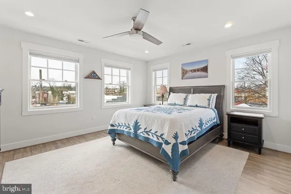 a white toilet sitting next to a bathroom sink