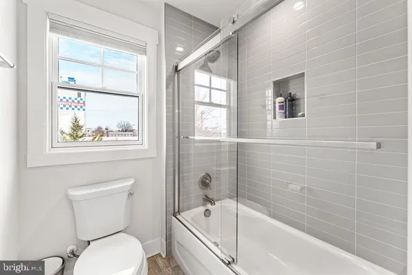 a bathroom with a sink toilet and vanity