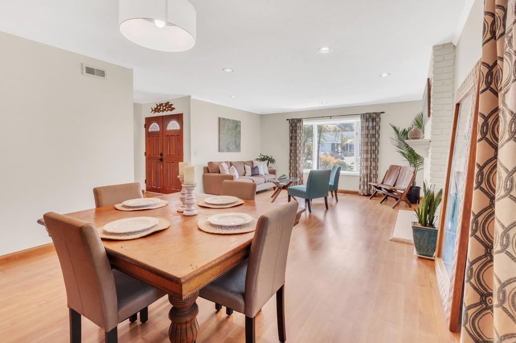 1528 Juniperhill Drive Encinitas, CA 92024 - Photo 12 of 40 a view of a dining room with furniture window and wooden floor