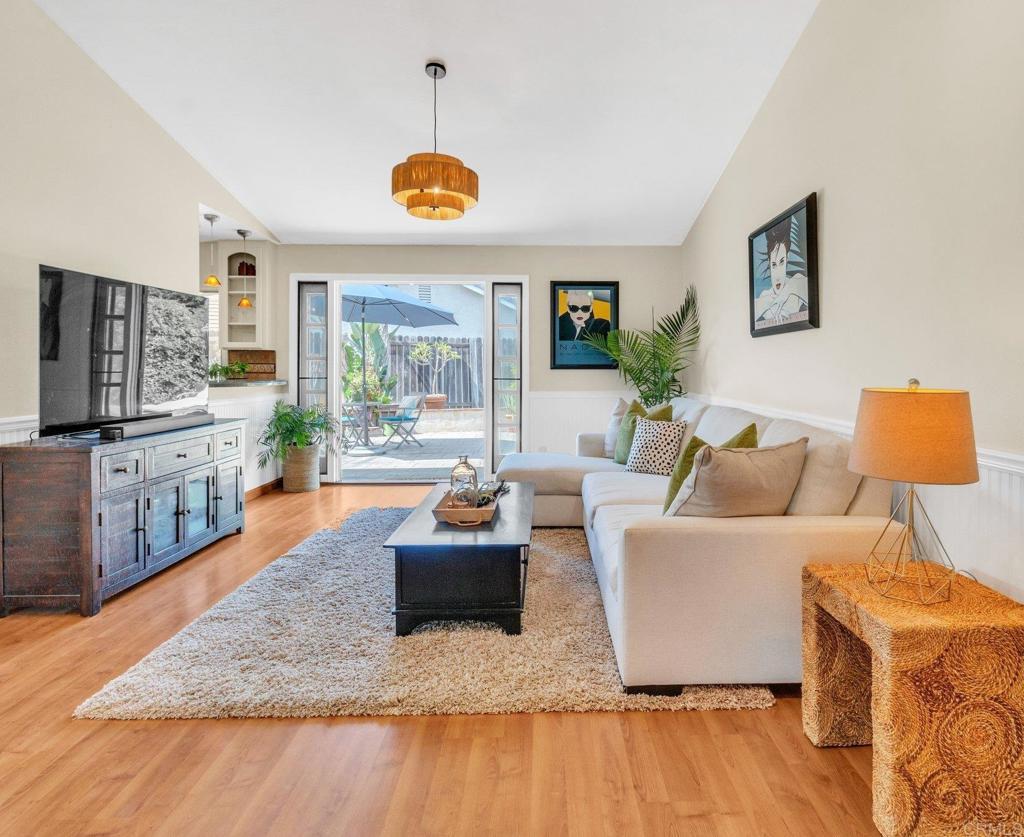 1528 Juniperhill Drive Encinitas, CA 92024 - Photo 16 of 40 a living room with furniture and a flat screen tv