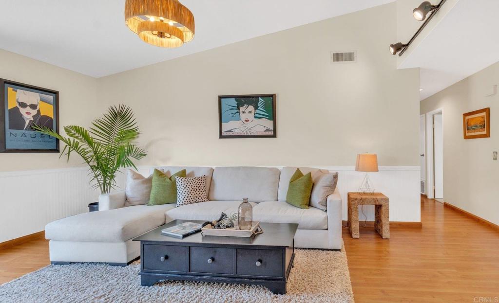 1528 Juniperhill Drive Encinitas, CA 92024 - Photo 17 of 40 a living room with furniture and a wooden floor