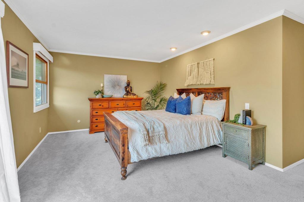 1528 Juniperhill Drive Encinitas, CA 92024 - Photo 19 of 40 a bedroom with a bed and window