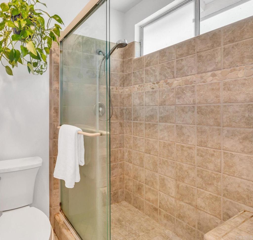 1528 Juniperhill Drive Encinitas, CA 92024 - Photo 24 of 40 a bathroom with a shower and toilet