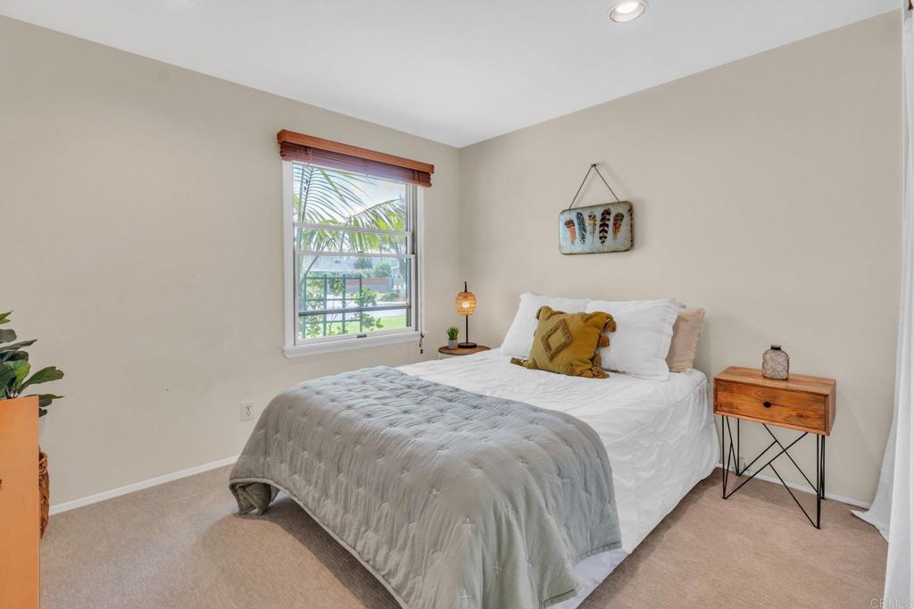1528 Juniperhill Drive Encinitas, CA 92024 - Photo 25 of 40 a bedroom with a bed and a window