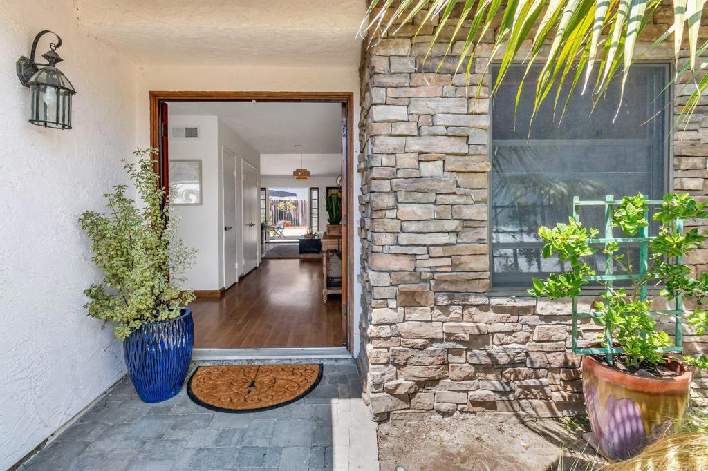 1528 Juniperhill Drive Encinitas, CA 92024 - Photo 6 of 40 a view of a entryway door and potted plants