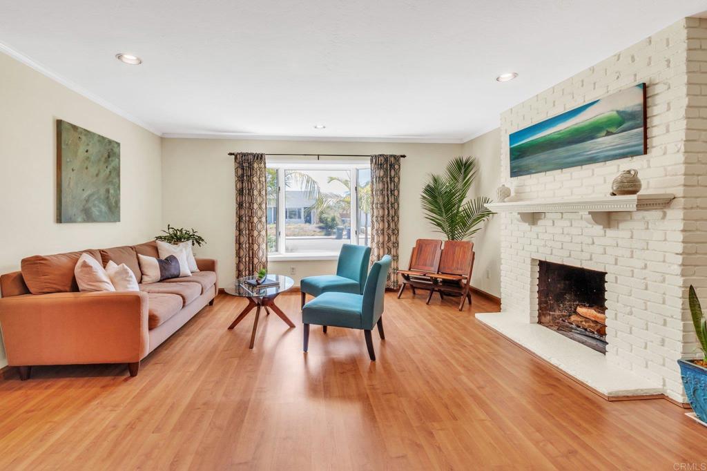 1528 Juniperhill Drive Encinitas, CA 92024 - Photo 7 of 40 a living room with furniture and a fireplace
