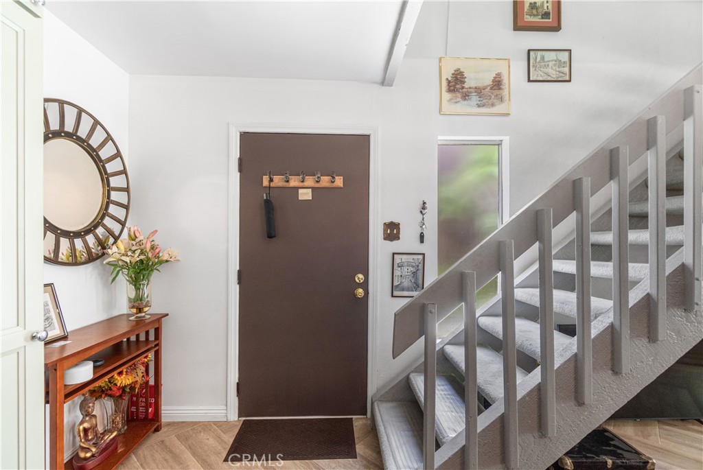 7890 East Spring Street, Unit 14A Long Beach, CA 90815 - Photo 20 of 43 a view of an entryway with wooden floor