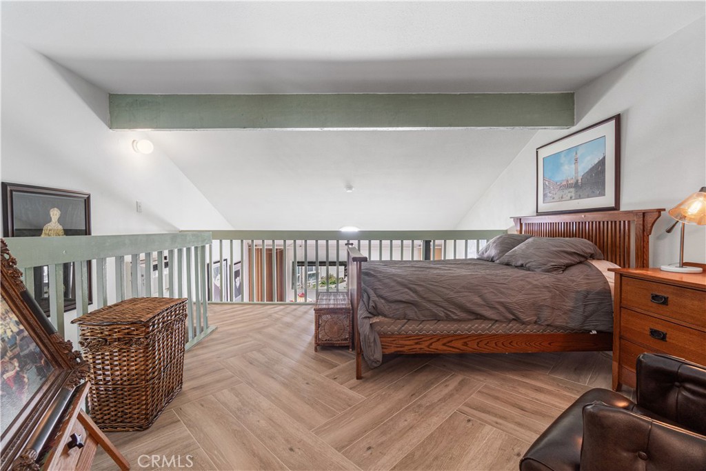 7890 East Spring Street, Unit 14A Long Beach, CA 90815 - Photo 22 of 43 a bedroom with a bed and a window