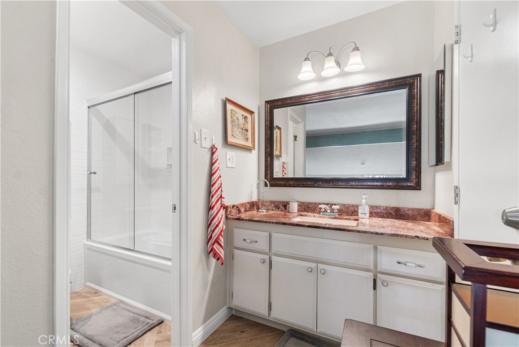 7890 East Spring Street, Unit 14A Long Beach, CA 90815 - Photo 23 of 43 a bathroom with a double vanity sink mirror and