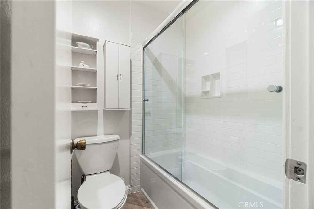 7890 East Spring Street, Unit 14A Long Beach, CA 90815 - Photo 24 of 43 a bathroom with a toilet and a shower