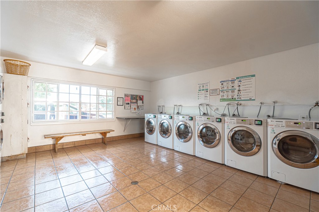 7890 East Spring Street, Unit 14A Long Beach, CA 90815 - Photo 30 of 43 a view of a storage & utility room with washer and dryer
