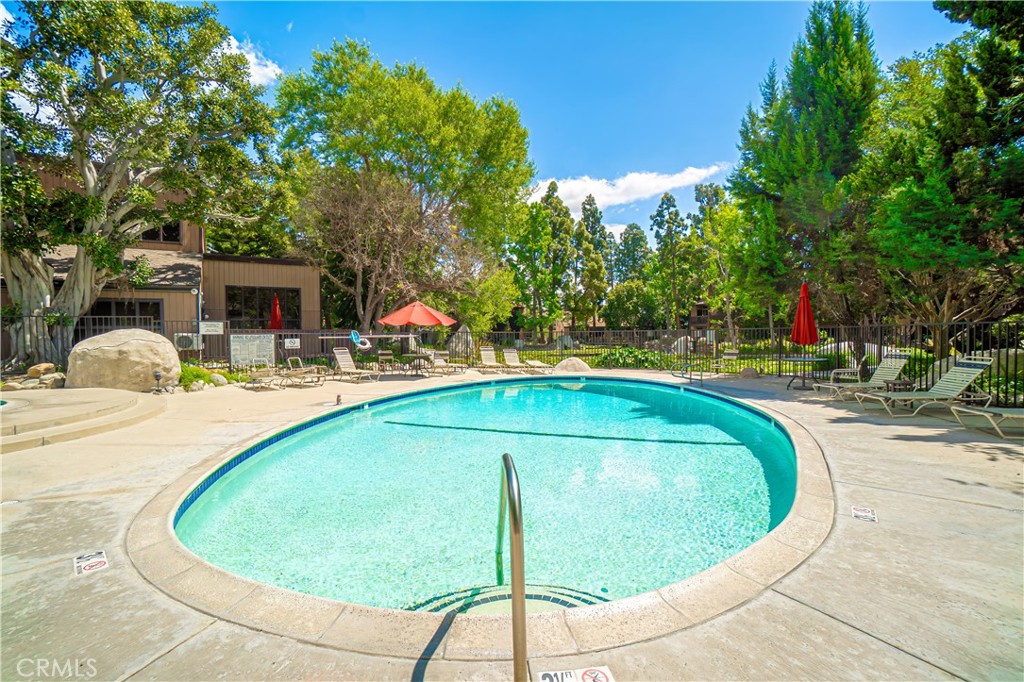 7890 East Spring Street, Unit 14A Long Beach, CA 90815 - Photo 33 of 43 a swimming pool with outdoor seating and yard
