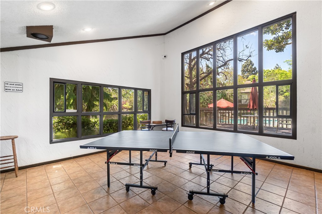 7890 East Spring Street, Unit 14A Long Beach, CA 90815 - Photo 39 of 43 a view of a room with furniture and large windows