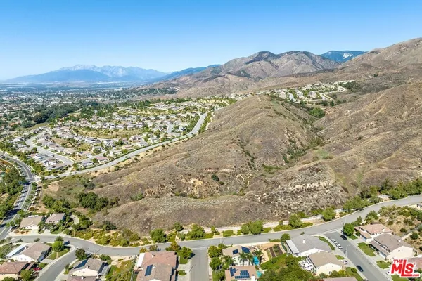 view of a mountain range with a lush green hillside