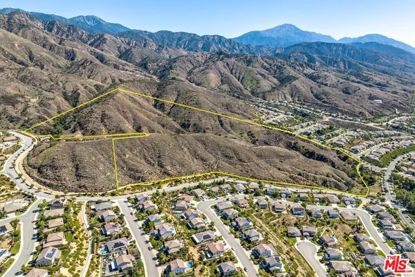 an aerial view of residential house and tree