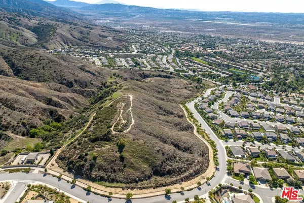 an aerial view of residential house and green space