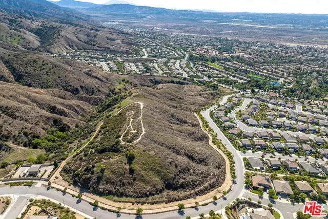 an aerial view of residential house and green space
