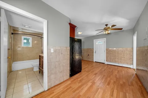 a view of livingroom with hardwood floor and a ceiling fan