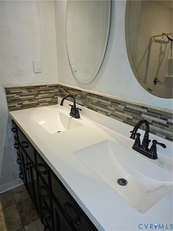 916 Brantley Road Richmond, VA 23235 - Photo 4 of 8 Full bathroom with double vanity, backsplash, and