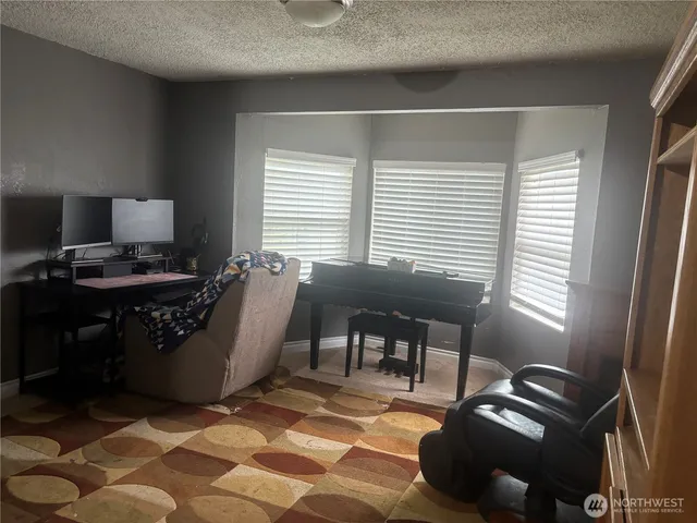 a workspace with furniture and a window